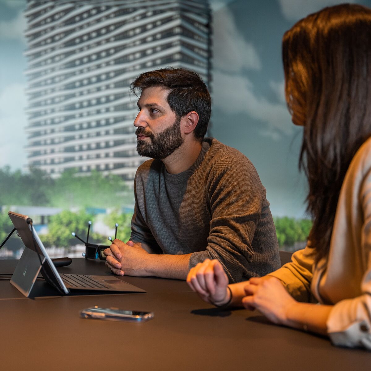 a man and a woman in a meeting